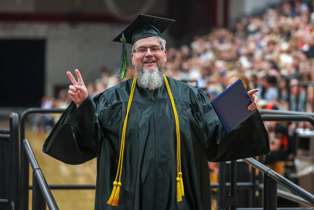 mptc student receiving their graduation diploma